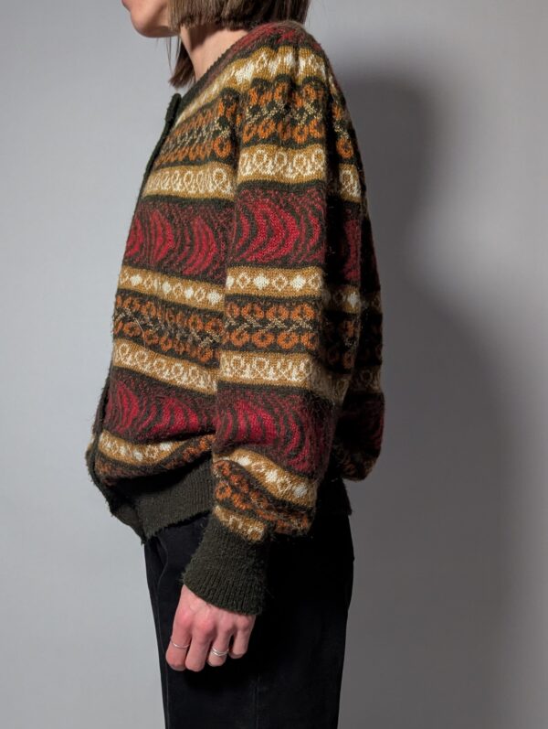 Vintage gebreid vest met warm patroon in aardetinten. Comfortabel en perfect voor herfstlooks.