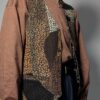 Vintage gilet van suède met een speels patchwork van aardse kleuren
