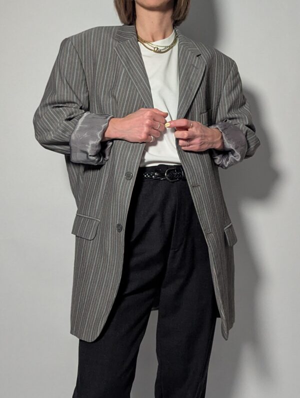 Vintage blazer in lichtgrijs met subtiele oranje streep