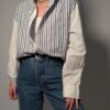 Vintage gestreepte blouse met contrasterende effen mouwen
