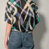 Vintage blouse met korte mouwen en abstracte print in zwart, teal, lila en crème.