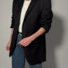 Vintage blazer in heel donker antraciet met rechte oversized fit en opvallende rode voering.