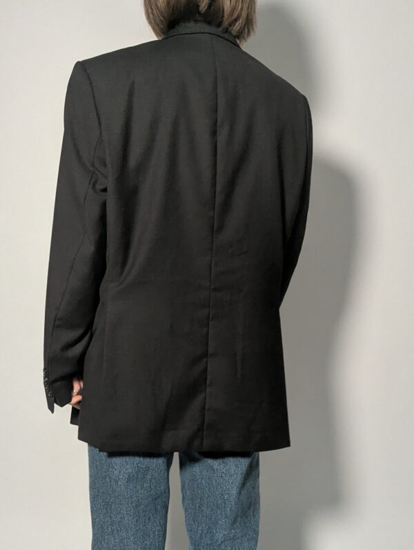 Vintage blazer in heel donker antraciet met rechte oversized fit en opvallende rode voering.