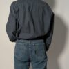 Vintage Hugo Boss blouse in blauwgrijze tint met lange mouwen, borstzak en relaxte pasvorm.