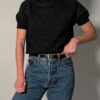 Vintage fijngebreide top in donkergrijs/antraciet met korte mouwen, hoge hals en knoopjessluiting in de nek aan de achterkant.