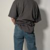 Vintage Dickies T-shirt in vaal zwart met korte mouwen, borstzak en subtiel logo detail.