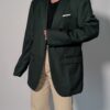 Vintage donkergroene blazer met rechte oversized pasvorm en klassieke tailored details.