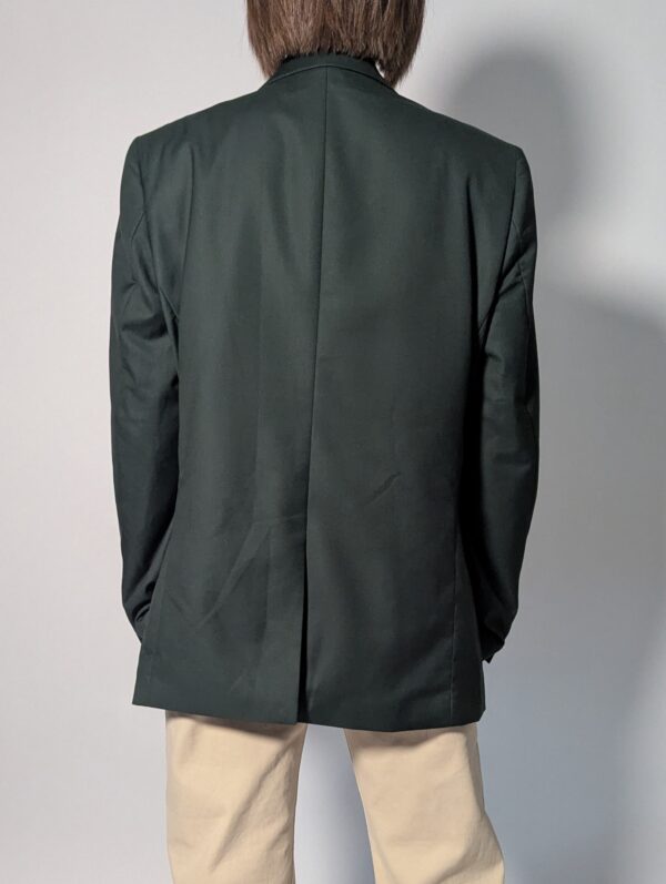 Vintage donkergroene blazer met rechte oversized pasvorm en klassieke tailored details.