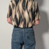 Vintage blouse met korte mouwen in zand, taupe en zwart met vloeiende abstracte print.