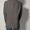 Vintage blazer in grijsbruine tint met subtiele plaid ruit, fijne krijtstreep en rechte oversized pasvorm.
