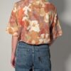 Vintage blouse met korte mouwen in zand, terracotta en beige met abstracte geschilderde print en borstzakken.