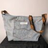 Denim tie-up 01 (RE)MADE BY LOT denim tas van lichtblauwe vintage jeans met back pocket en hengsels gemaakt van een hergebruikte stropdas.