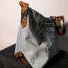 Denim tie-up 06 (RE)MADE BY LOT denim tas van lichtblauwe vintage jeans met back pocket en hengsels gemaakt van een hergebruikte stropdas.