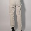 Vintage off-white ribbroek met hoge taille, rechte pijpen en fijne ribstructuur.