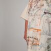 Vintage oversized off-white T-shirt met technische schetsprint in blauw, oranje en bruin, lang model dat ook als jurk gedragen kan worden.